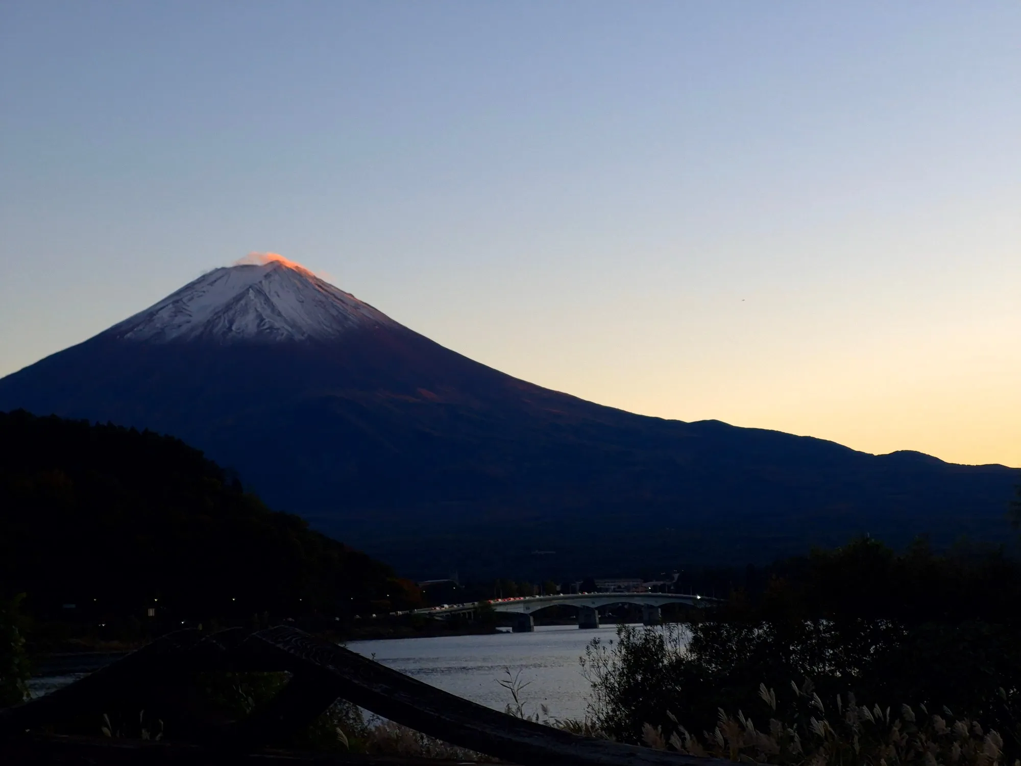Mount Fuji at dusk above Lake Kawaguchiko.